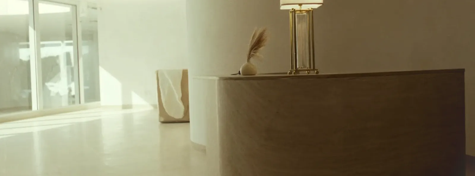 The empty front desk of an aesthetics clinic, with nobody there to answer the phone